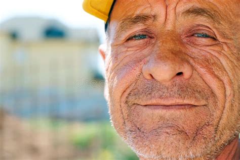 Old Wrinkled Man With Yellow Cap Stock Image Image Of Pensioner