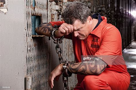 Prisoner On His Knees Praying In Jail High Res Stock Photo Getty Images