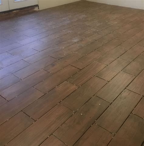 Wood look porcelain tiles wood look porcelain couples the real wood aesthetic with the durability of porcelain. Acadia Brown ceramic tile. Looks like wood. | Wood look tile, Flooring, Wood floors