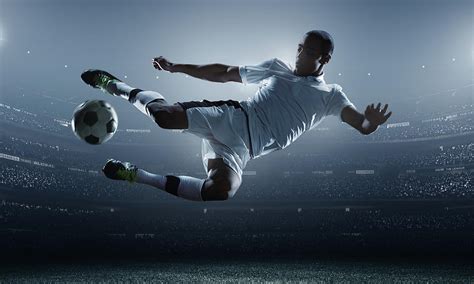 Soccer Player Kicking Ball In Stadium By Dmytro Aksonov