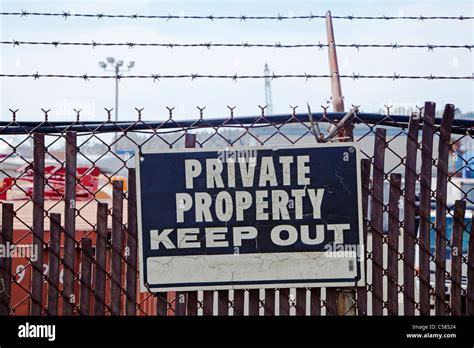 Private Property Sign Mounted On Chain Link Fence Stock Photo Alamy