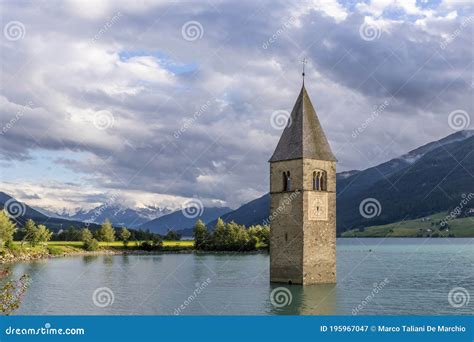 The Bell Submerged Tower Of Reschensee Church Deep In Resias Lake