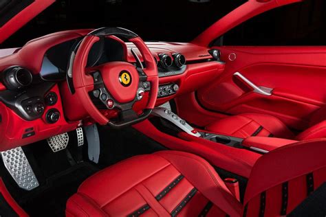 The Interior Of A Red Sports Car