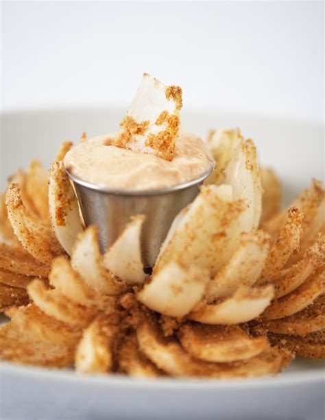 Using a large, sharp knife, slice down the center of the onion about 3/4 of the way down, turn 90 degrees and slice again. Baked Bloomin Onion With Dipping Sauce - Blooming Bites ...