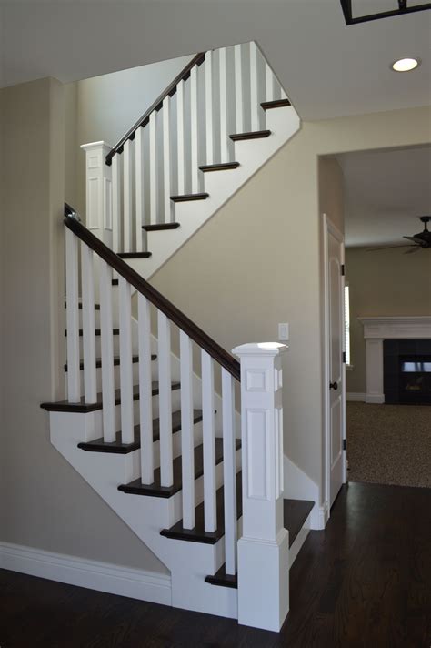 Direct stair parts is the premiere resource for your next stair remodel or project. Open railing with hardwood stairs. We love how the dark wood and white painted wood look togeth ...