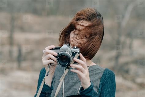 Young Pretty Girl Holding Camera Stock Photo 104045 Youworkforthem