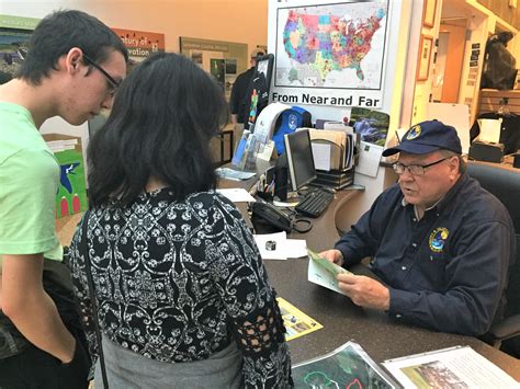 Front desk volunteer assists visitors at Savannah NWR | FWS.gov