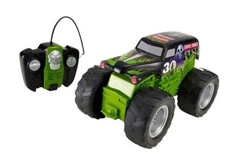 A Green Monster Truck With Two Large Tires