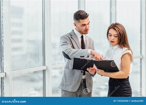 Cute Female Secretary And Her Boss Discussing New Project Stock Photo Image Of Hand Document