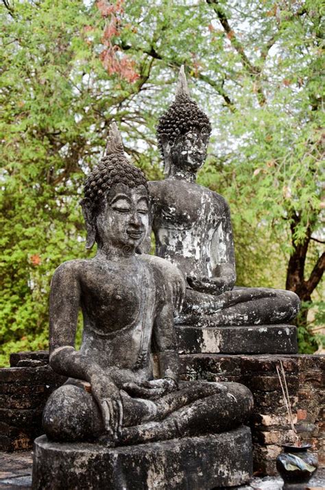 Seated Buddha Statues In Famous Sukhothai Historical Park Stock Photo