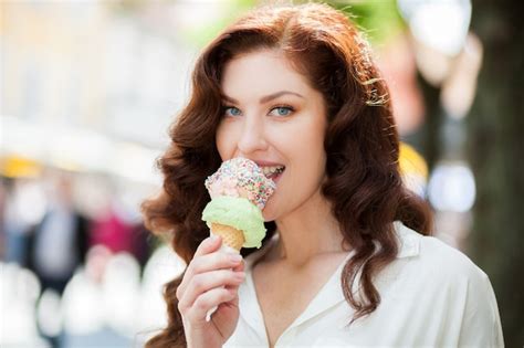 Premium Photo Beautiful Woman Enjoying An Ice Cream