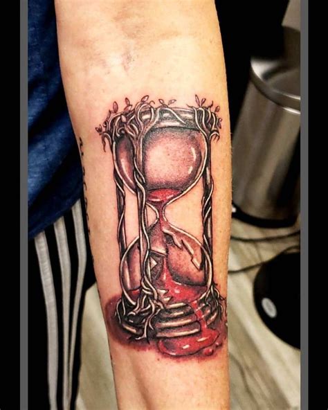 An Hourglass Tattoo On The Arm