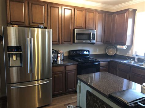It's a great, neutral choice for those looking for a gray shade with a little bit more body than a light gray. Dorian Gray Kitchen - 2 Cabinet Girls