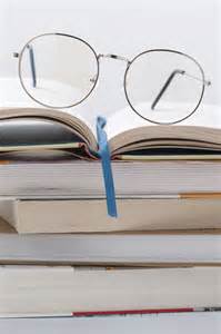 Free Photo Low Angle Stack Of Books With Glasses On Top