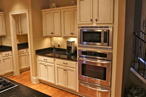 Remove doors, drawer fronts and hardware. Painted Kitchen Cabinets by Bella Tucker Decorative Finishes - Bella Tucker