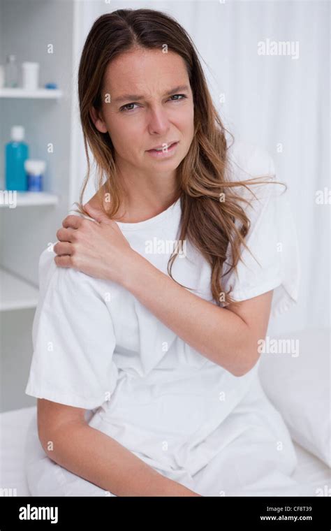 Woman Covering Painful Shoulder Stock Photo Alamy