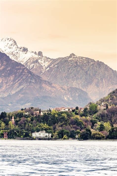 Villa In Como Lake Italy With Snow And Mountain Looking From Boat In