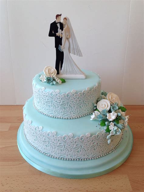 Two Tier Blue Wedding Cake With White Sugar Lace And A Modern Bride And