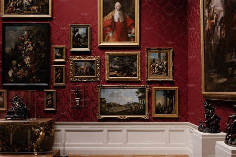 A Red Wall Of Paintings In A Museum High Quality Arts And Entertainment