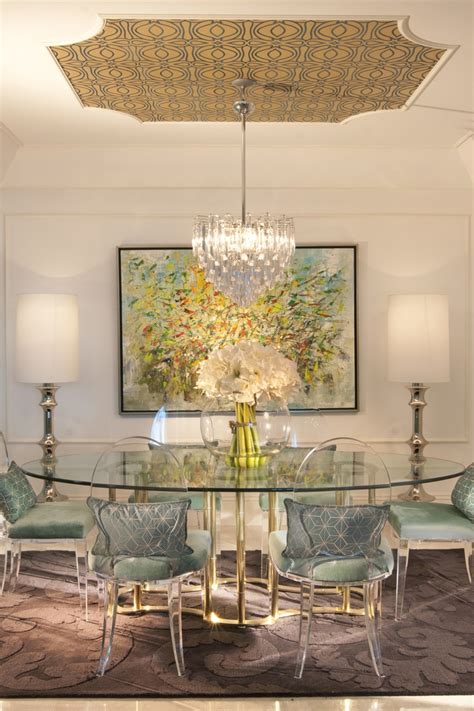 An Image Of A Dining Room Table With Chairs And Chandelier On The Wall