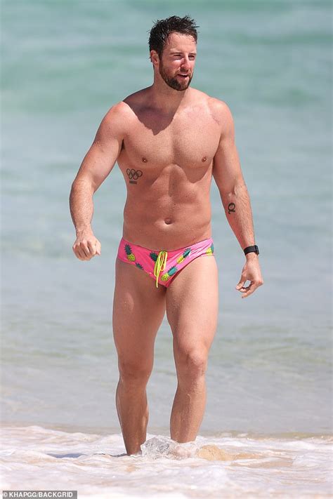 sas australia s james magnussen shows off his muscular build in tiny speedos as he hits the