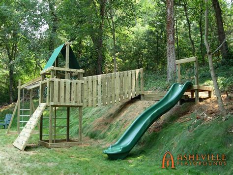 Playground Uses The Backyard Hill For Slide And Suspension Bridge