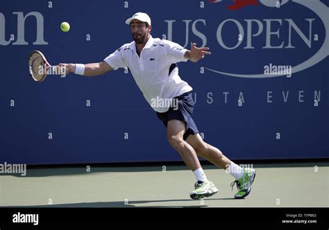 Pablo Cuevas Of Uruguay Runs To Return A Ball In The Fifth Set Against