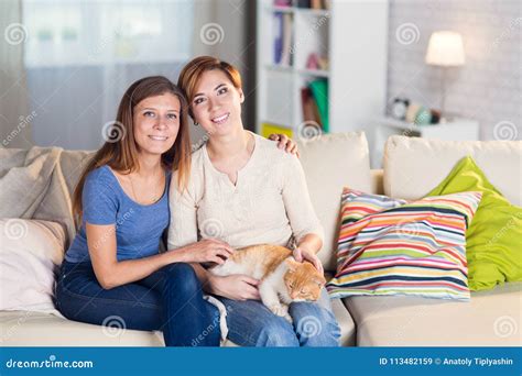 Homosexual Couple Of Lesbian Women At Home On The Couch Stock Image Image Of Home Girlfriend