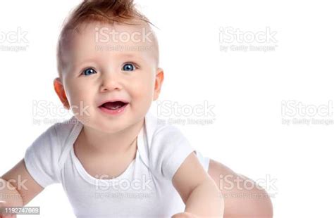 Infant Child Baby Boy Kid With Blue Eyes Happy Smiling Screaming Lying
