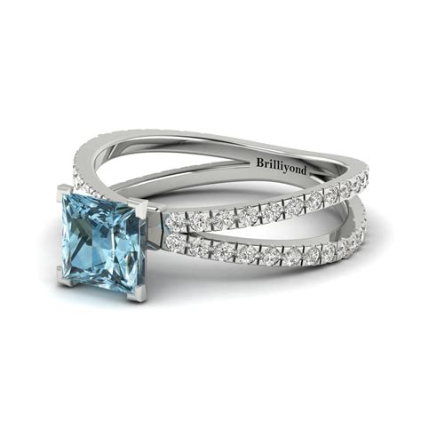 Tiffany paper flowers®:diamond and aquamarine firefly ring in platinum. A splendid princess cut engagement ring featuring a blue Aquamarine gemstone. Handset on a split ...