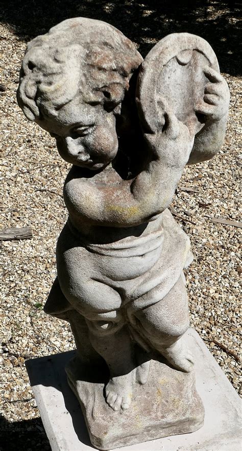 Antiques Atlas Old Weathered Statue Of A Putti Playing Tambourine