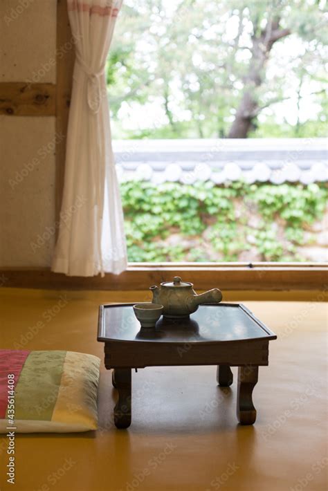 Wooden Korean Tea Table With Traditional Korean House In The Historic