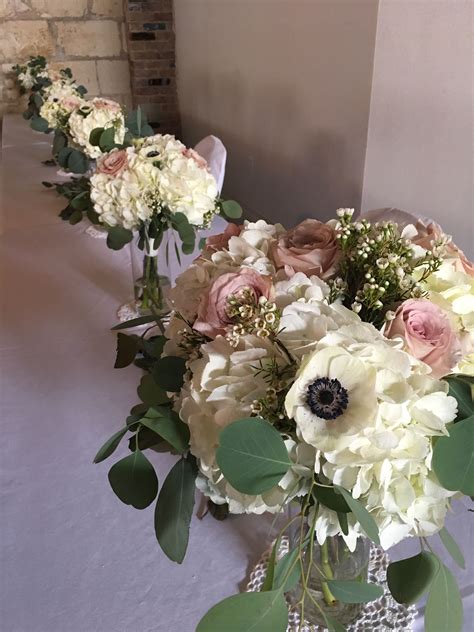 32 creative ways to use white ranunculus in your wedding décor Bridal bouquet and bridesmaids' bouquets with white ...