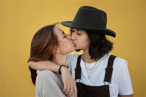 free photo adorable lesbian couple kissing outdoors