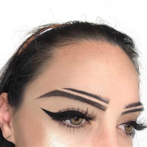 According to the oregonian, a vertical slit shaved off the eyebrow is a gang symbol indicating membership. Split Brows Are Instagram's Latest Brow "Trend" | Allure