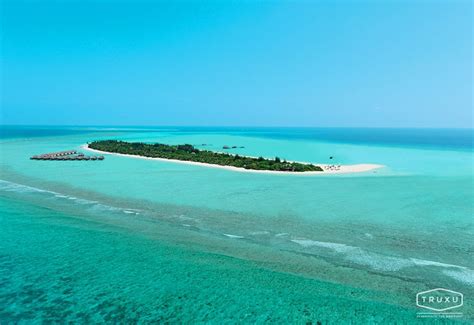 Amidst The Beautiful Turquoise Waters Of An Atoll In The Indian Ocean