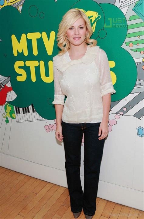 elisha cuthbert wearing white top and black jeans super wags hottest wives and girlfriends