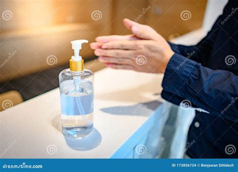 Washing Hands By Alcohol Sanitizers From Bottle Stock Photo Image Of