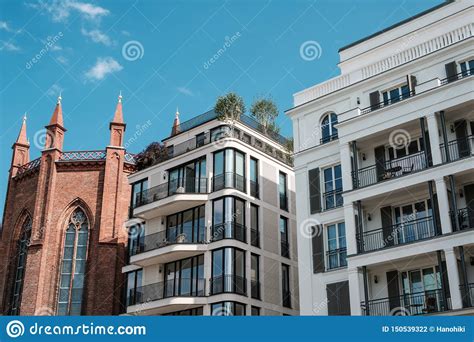 Modern Architecture Apartment Buildings And Old Church Real Estate In