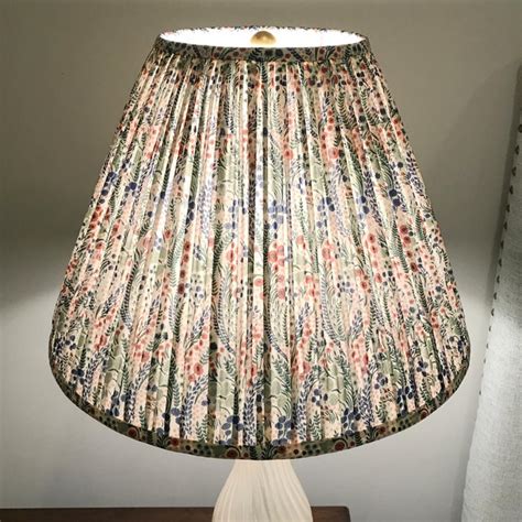 Avoid using a lint roller on thin, delicate lamp shade fabrics, as the roller's stickiness could tear the material. Pleated Floral Lamp Shade, Liberty London Fabric | Chairish