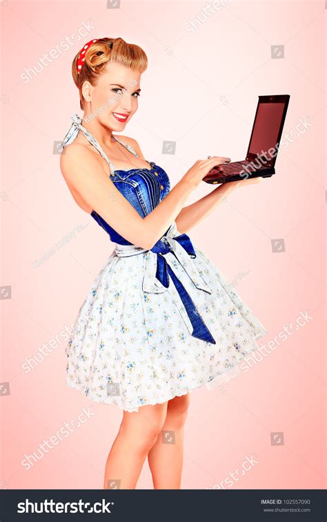 Smart Pin Up Girl Posing Over Pink Background With A