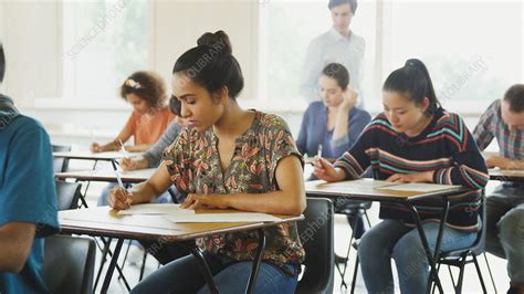 College Students Taking Test At Desks Stock Image F0185091