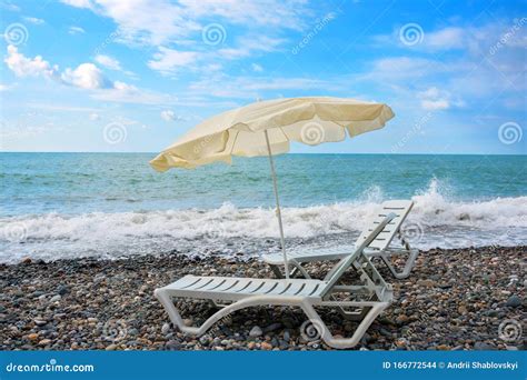 Two Chaise Lounges And A Sunshade On The Sea Beach Stock Photo Image Of Chair Azure