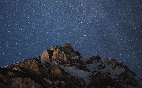 Download Wallpaper 1680x1050 Mountain Peak Starry Sky Night Dark