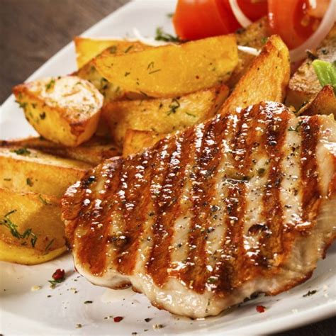 This Tasty Looking Grilled Pork Steak Is Perfect With Roasted Potatoes