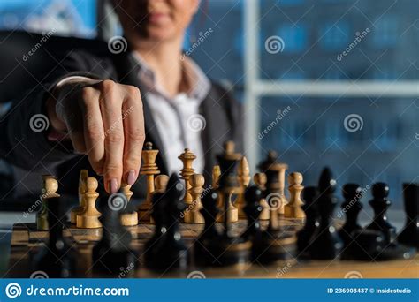 Business Woman In A Suit Plays Chess Close Up Of A Female Hand On A Pawn Stock Image Image Of