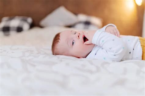 Cute Baby Boy On Bed — Stock Photo © Lenamiloslavskaya 151081300