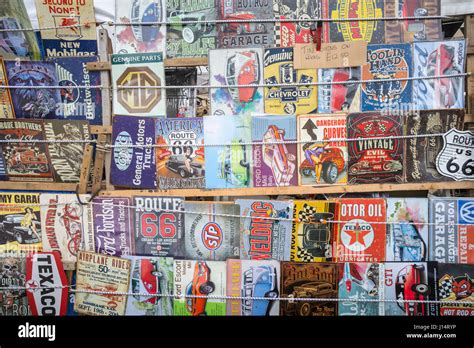 Stall selling old vintage car memorabilia enamel plates Stock Photo - Alamy