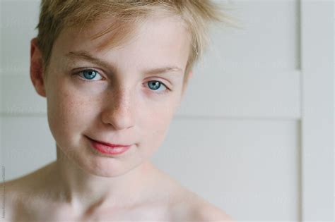 Portrait Of A Half Smiling Teenage Boy By Stocksy Contributor Helen