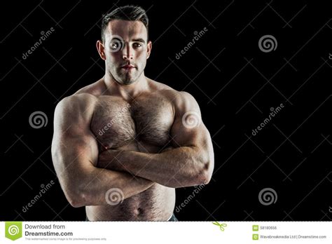 Strong Bodybuilder With Arms Crossed Stock Photo - Image of healthy, posing: 58180656